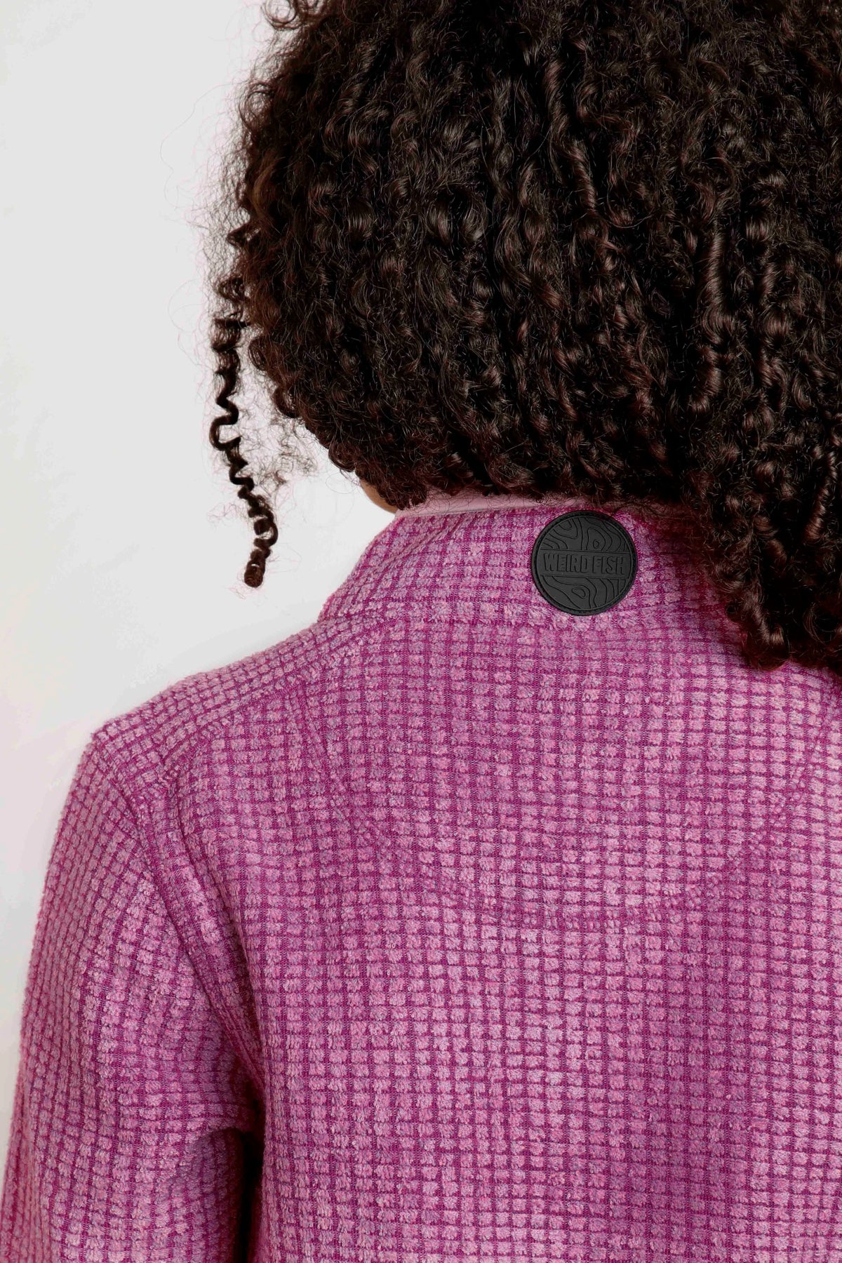 Weird Fish childrens Archie grid fleece in Raspberry with rubber logo collar patch.