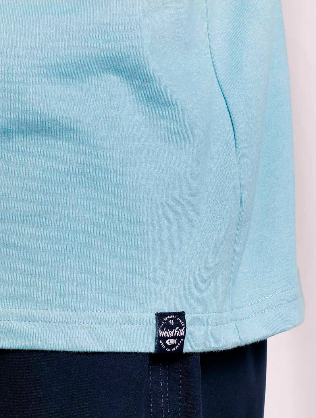 Weird Fish men's Paddle T-shirt in Sky Blue with hem logo label.