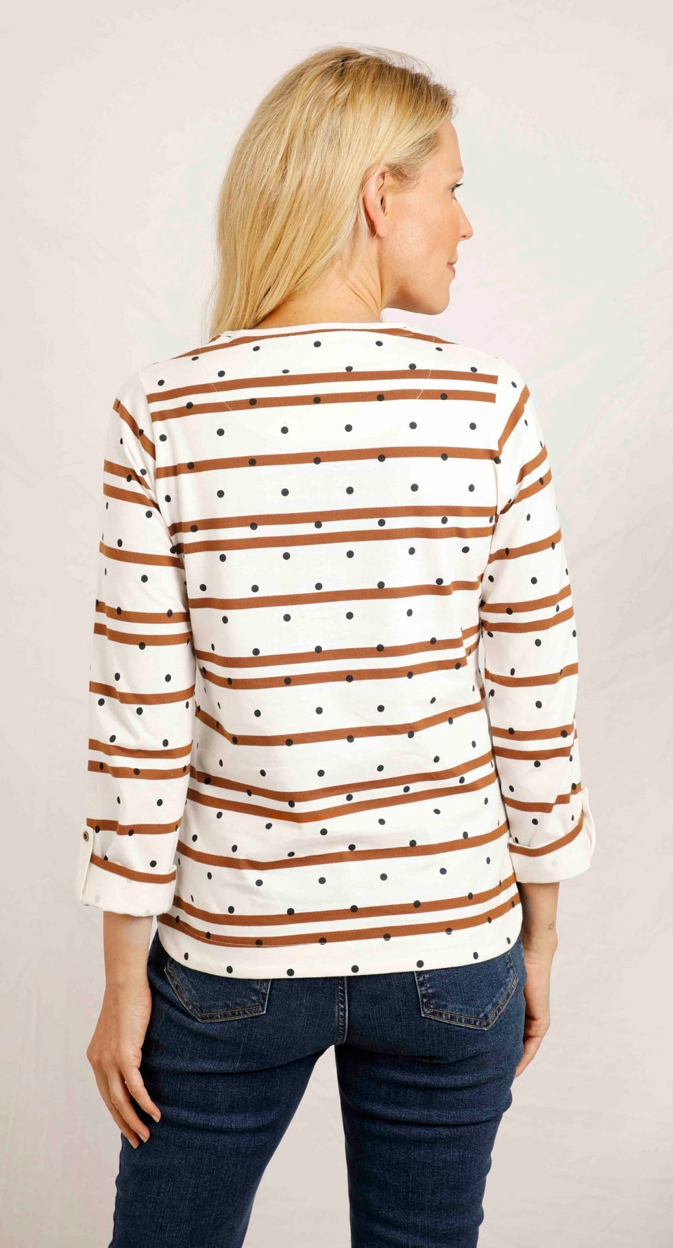 A women's Billie long sleeve t-shirt from Weird Fish in light cream with a stripe and dot pattern, with a crew neckline and roll up sleeves.
