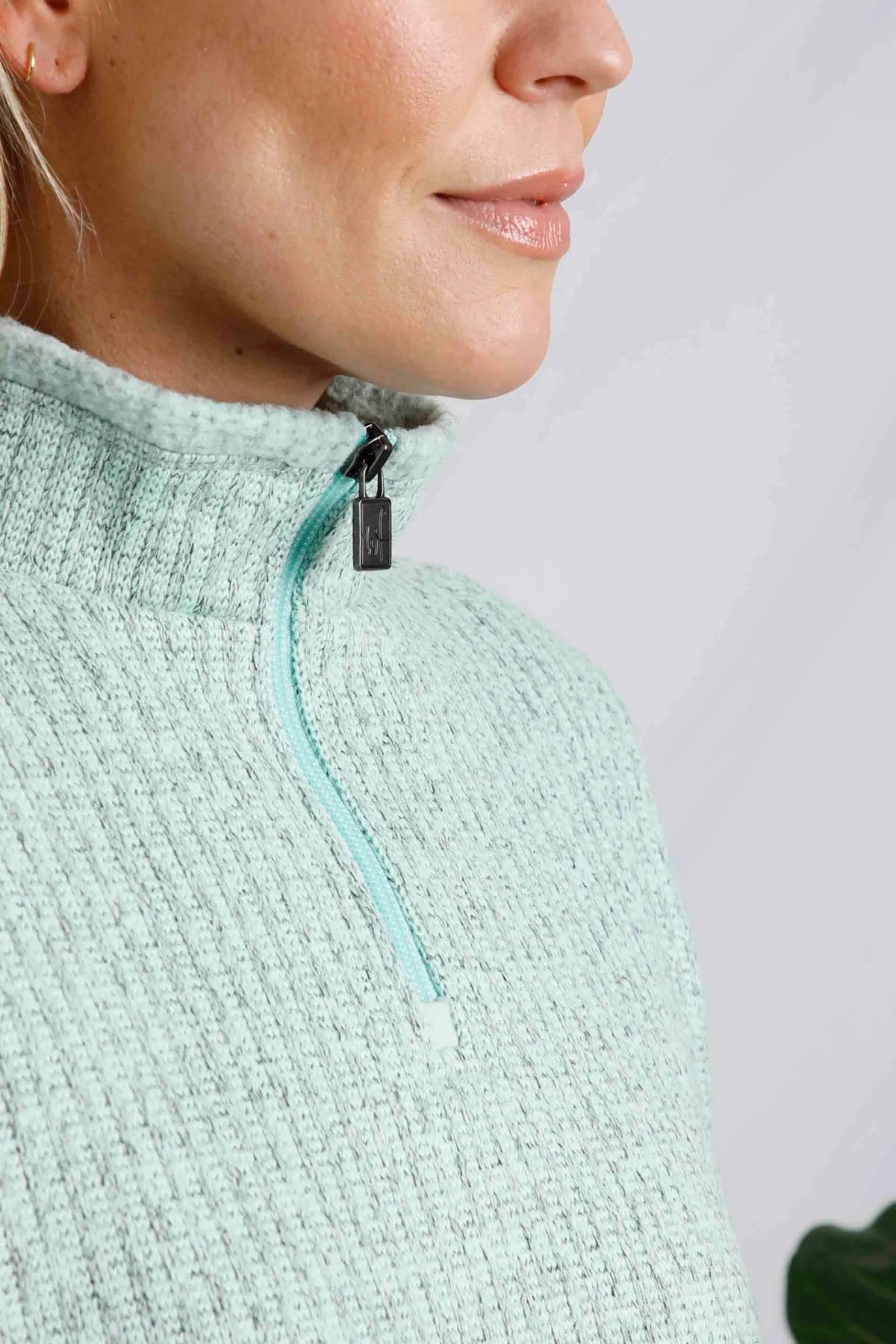 Weird Fish women's Omila rib textured knitted fleece in Mint Green with 1/4 zip neckline.