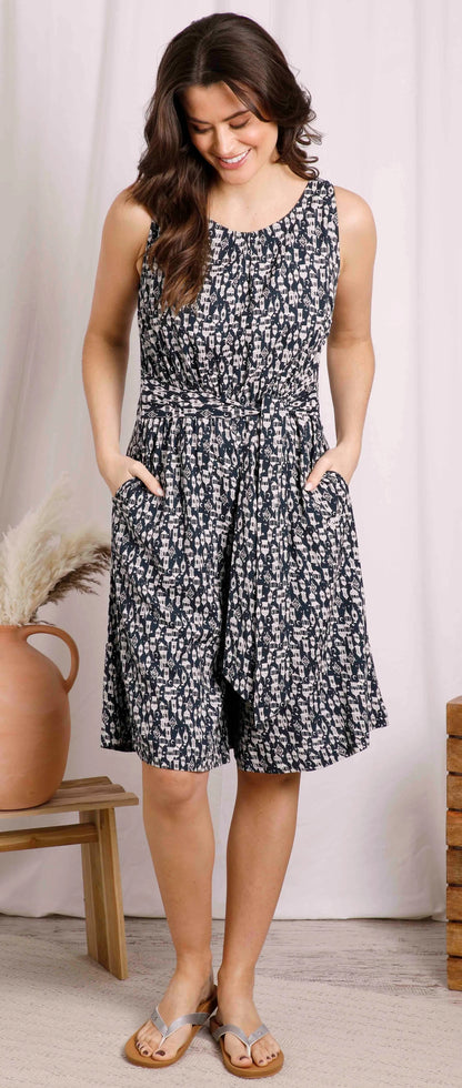 Weird Fish women's sleeveless Roxi viscose culotte jumpsuit in Midnight Navy with lantern print and front pockets.