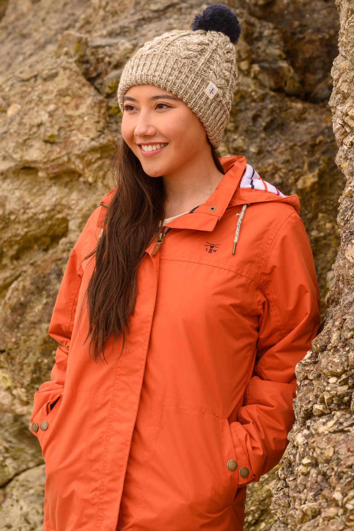 Waterproof women's Eva paddded rain jacket in Burnt Orange from Lighthouse.