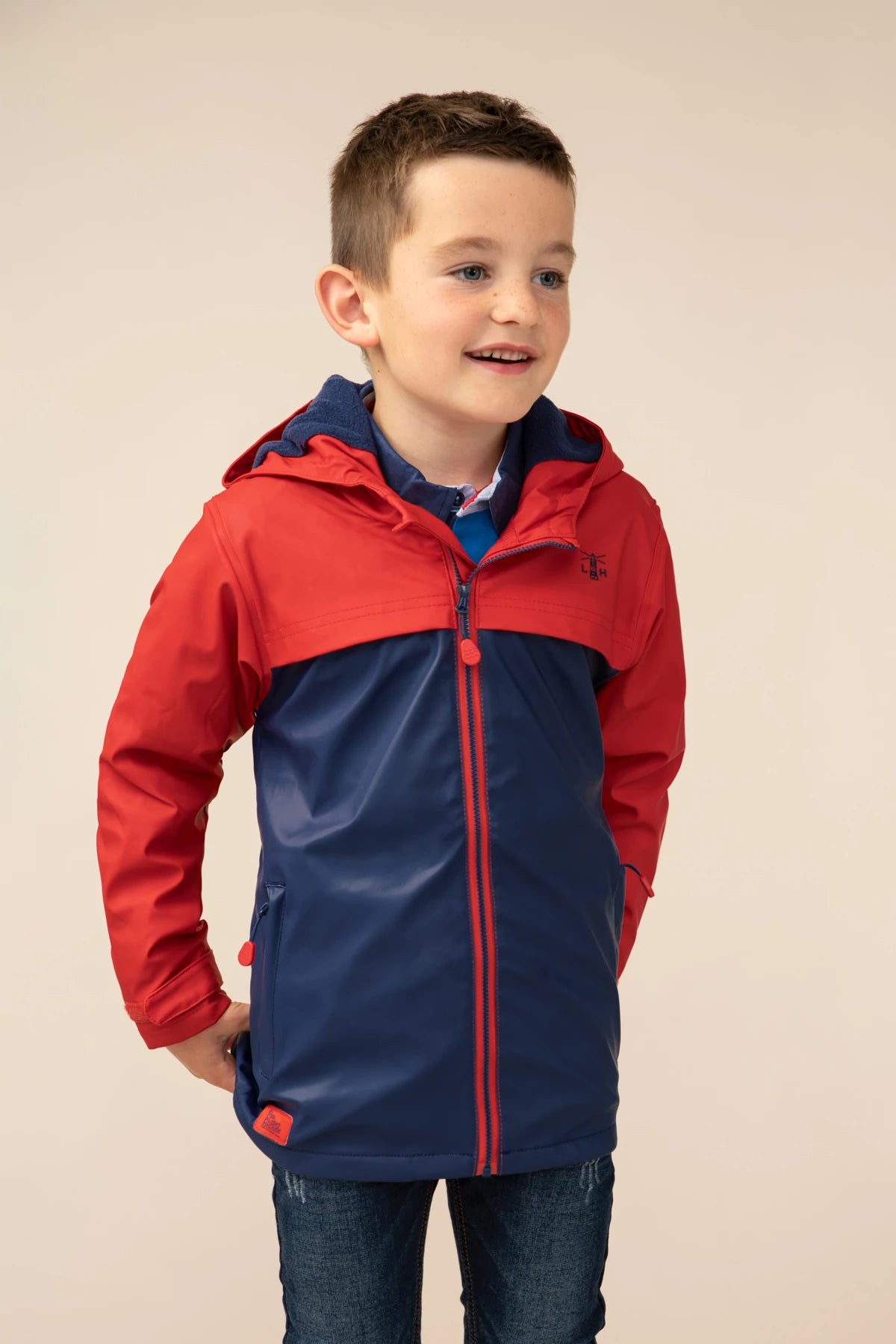 Lighthouse kids Adam waterproof rain coat in two tone red and navy.