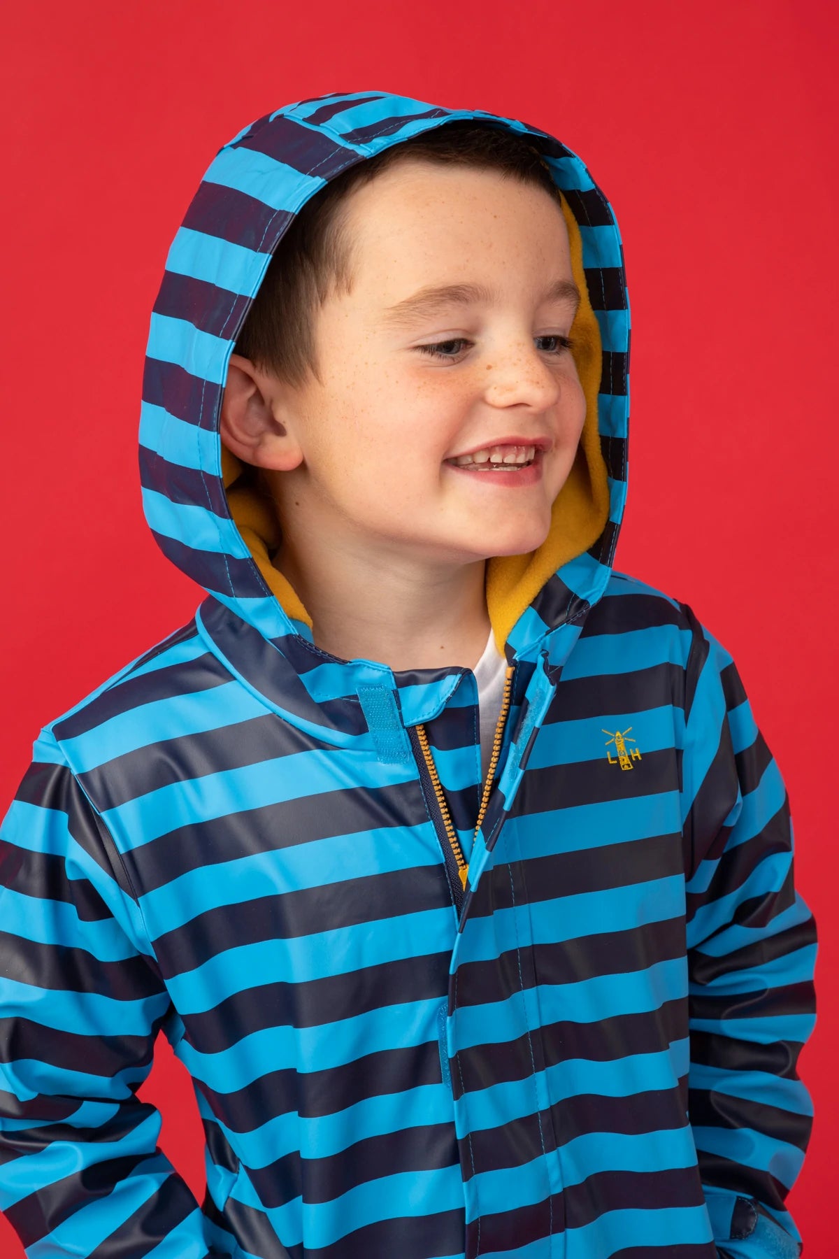 Lighthouse kids polyurethane waterproof Adam style rain jacket in a blue stripe pattern with fleece lining.