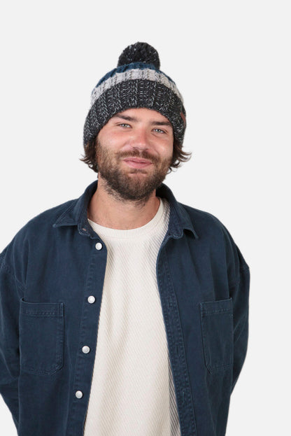 Wilhelm adults bobble beanie knitted hat from Barts in Charcoal Grey and Blue stripe pattern.