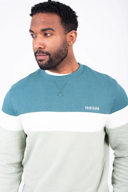 A crew or round neck men's sweatshirt from Brakeburn in a teal, blue or green block stripe pattern.