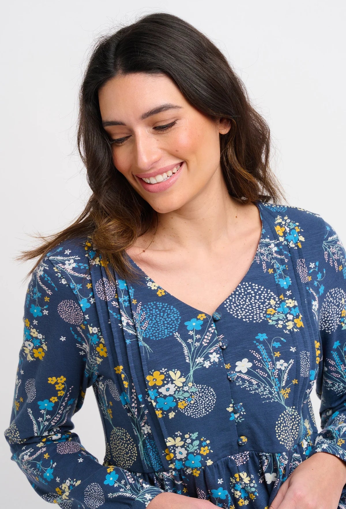 Women's tunic length long sleeve blouse in navy with Bursting Blooms floral print