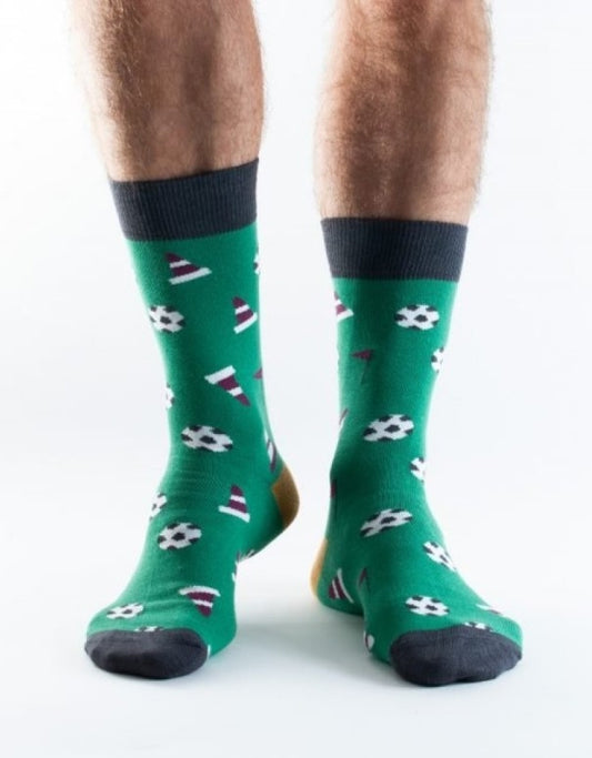 Men's bamboo socks from Doris & Dude in green with a football print.