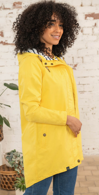 Lighthouse yellow waterproof jacket womens with hood and snap button details