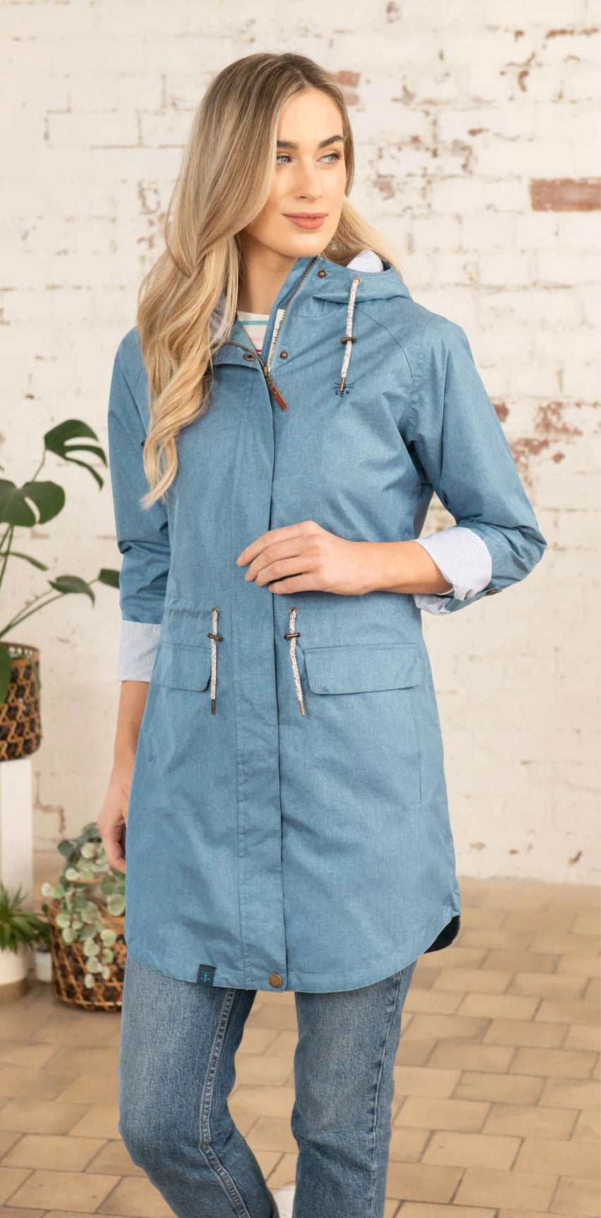 Lighthouse women's Alice waterproof rain jacket in Soft Teal. 