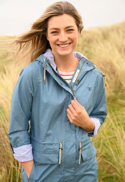 Lighthouse women's Alice waterproof rain jacket in Soft Teal with drawstring waist.