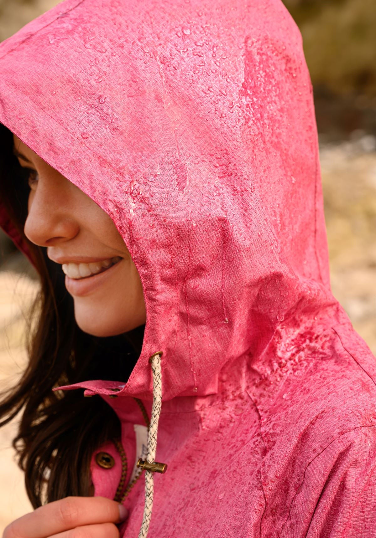 Lighthouse women's Alice waterproof rain coat in Pink with drawstring waist.