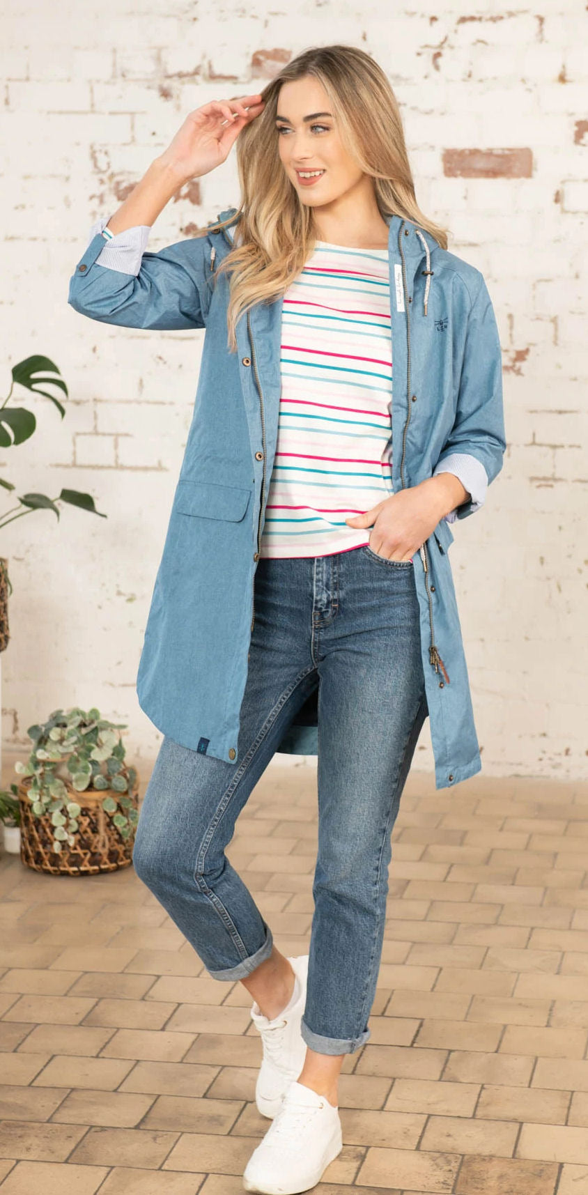 Lighthouse women's Alice waterproof rain coat in Soft Teal with drawstring waist.