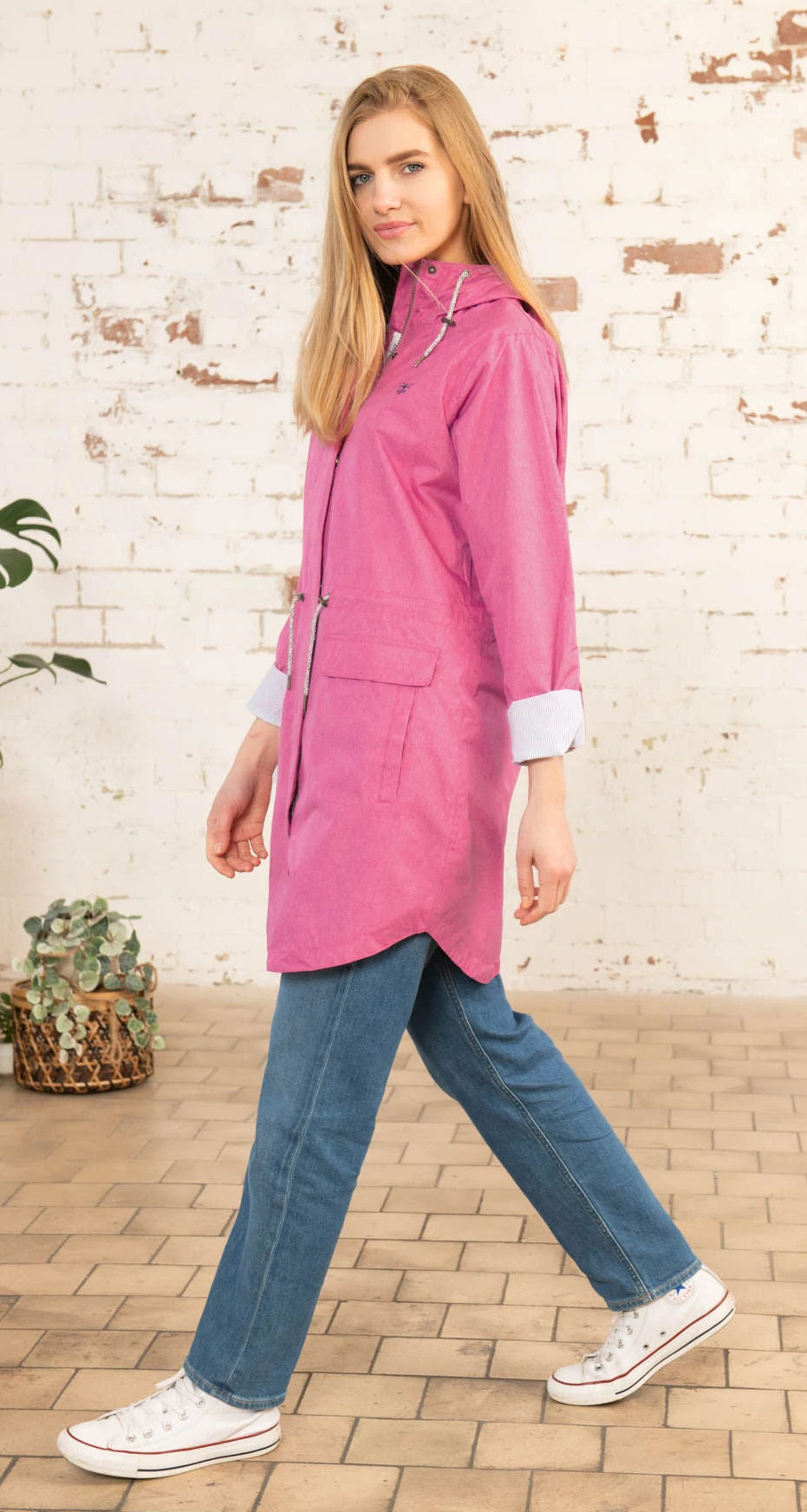Lighthouse women's Alice waterproof rain coat in Pink with drawstring waist and roll back sleeves.