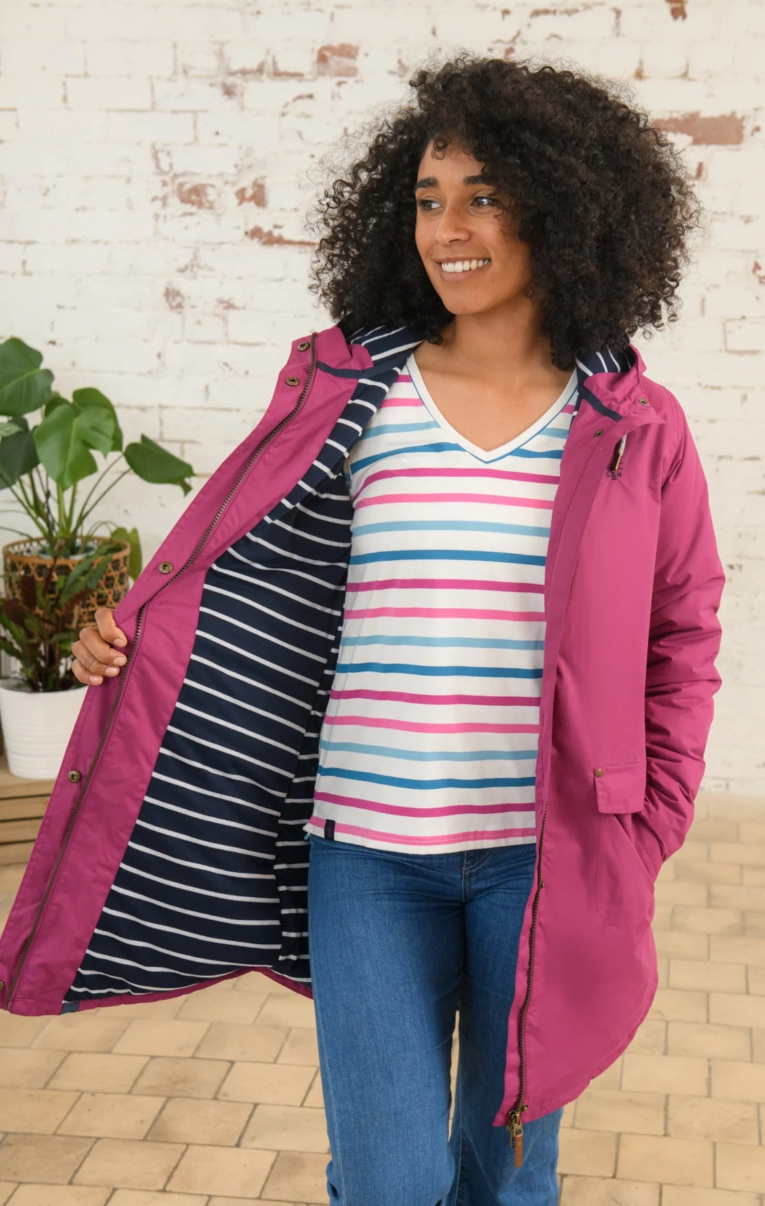 Lighthouse women's padded waterproof Iona Long coat with stripe lining.