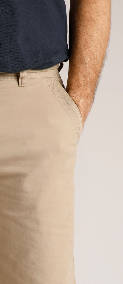 Weird Fish mens Rayburn chino shorts Taupe Grey worn by model with hand in pocket and navy shirt