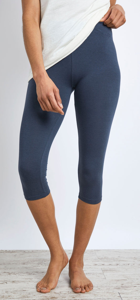 A pair of womens Weird Fish Blondie cropped leggings in navy, featuring an elasticated waistband and a small embroidered logo on the hip.